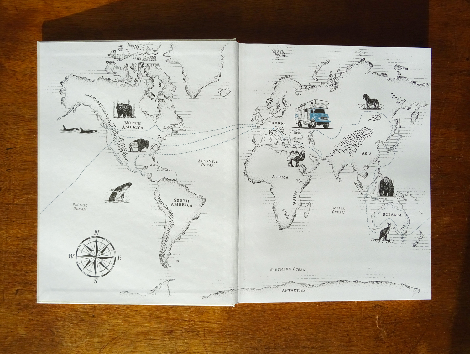 Spread featuring the illustrated map of the world